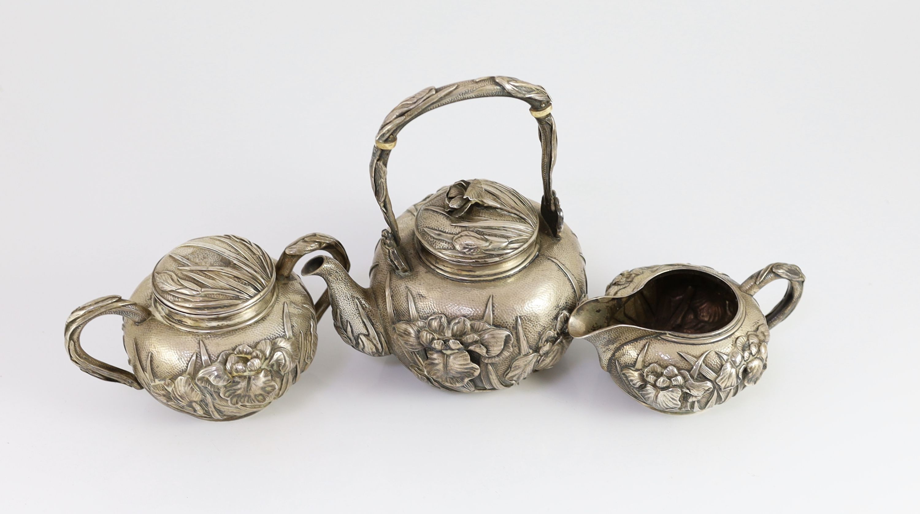 A Japanese Meiji period three piece silver tea set